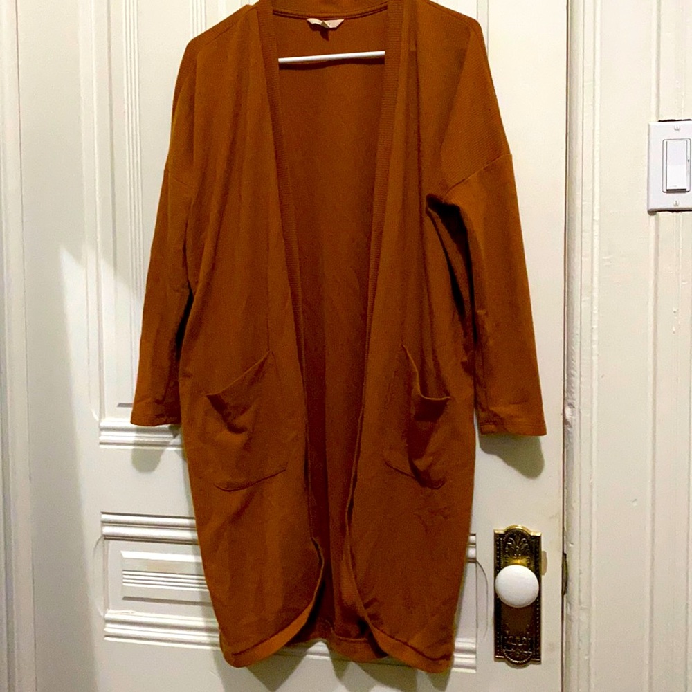 Khaki Colored cardigan. Size Medium. In good condition.